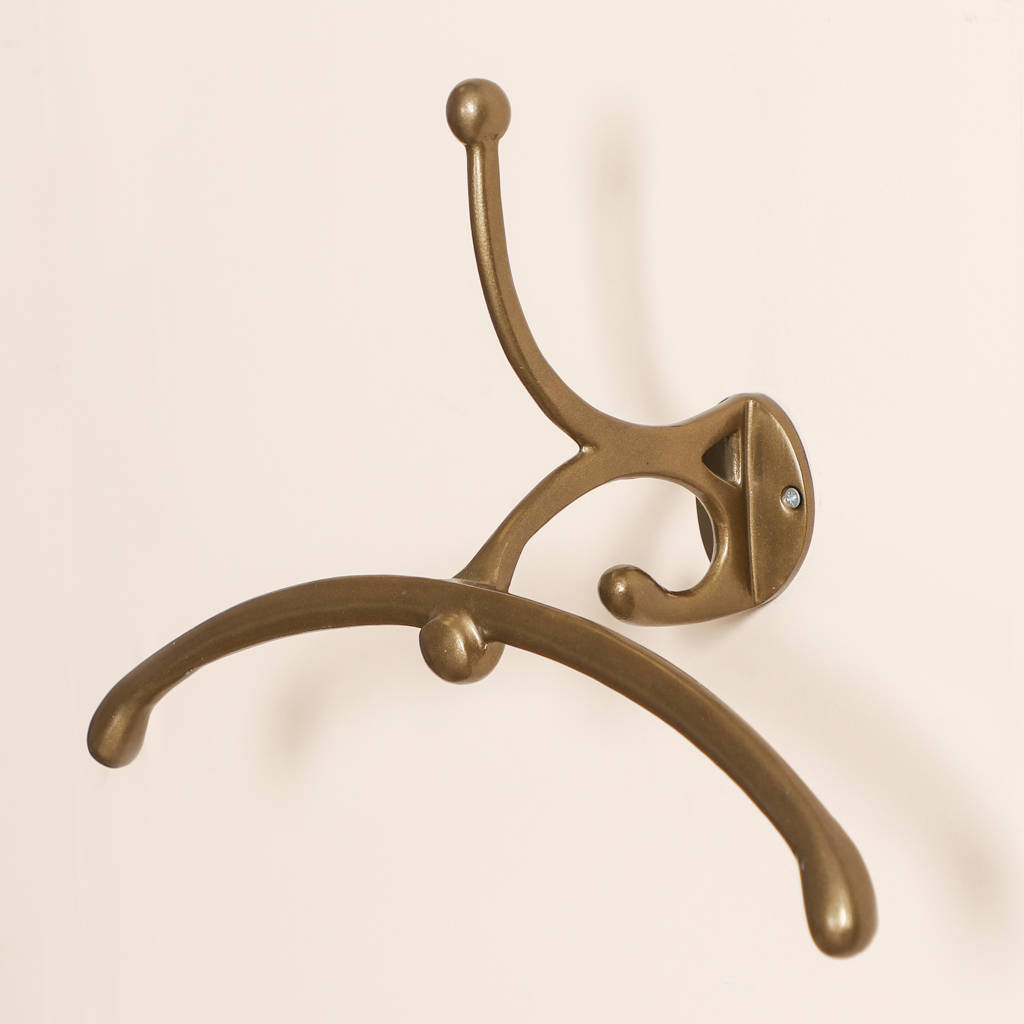 gold wall mounted clothes rail by dibor