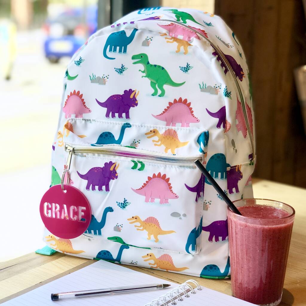 Personalised Rainbow Dinosaur Backpack With Zip Tag, 1 of 2