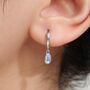 Sterling Silver Dangling Oval Moonstone Hoop Earrings, thumbnail 1 of 11