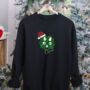 Personalised Black Christmas Jumper With Sparkling Dinosaur Face, thumbnail 1 of 7