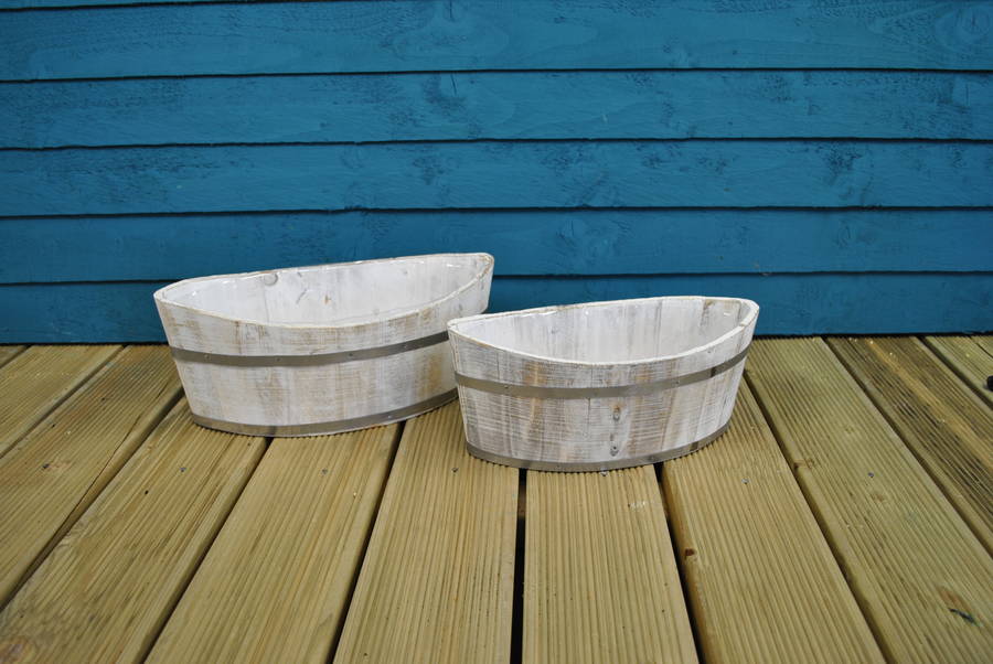 white washed boat shaped planters by garden selections