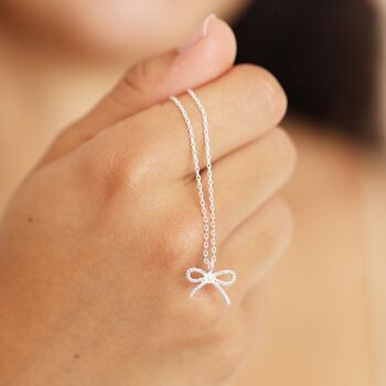 Tiny Pearl Bow Pendant Necklace, 9 of 9