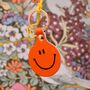 'Feeling Lush' Smilie Leather Keyring In Orange, thumbnail 1 of 3