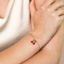 Enamel Cherry Bow Charm Bracelet In Gold Plating, thumbnail 1 of 6