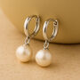 Sterling Silver Round Pearl Huggie Hoop Earrings, thumbnail 1 of 5