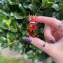 Hand Blown Glass Reindeer With Santa Hat, thumbnail 3 of 6