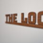 The Loo Sign: Walnut Wood Door Topper With Adhesive Dots, thumbnail 4 of 7