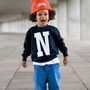 Personalised Kids Letter Sweatshirt In Black, thumbnail 1 of 9