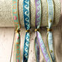 Set Of Four Festival Ribbon Bracelets, Waves/Words, thumbnail 4 of 5