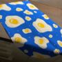 Fried Egg Pattern Full Colour Blue And Yellow Tea Towel, thumbnail 1 of 3
