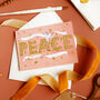 Pink And Gold Christmas Card 'PEACE', thumbnail 1 of 6