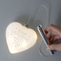 Personalised First Christmas LED Glass Heart Christmas Bauble, thumbnail 2 of 4