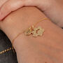 Gold Plated Paw Print And Initial Bracelet, thumbnail 1 of 3