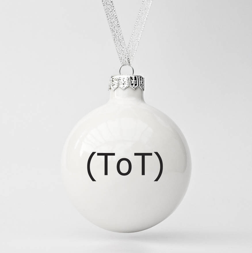 modern christmas bauble with emoticon by kina ceramics