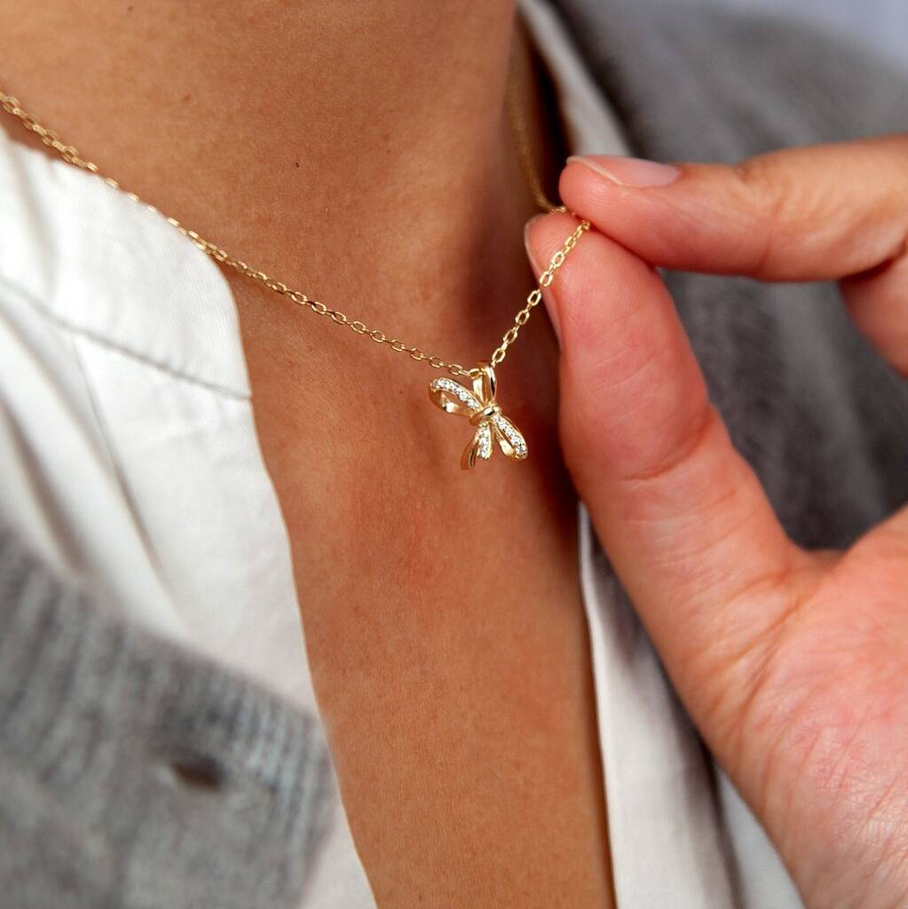 Gold Sparkle Bow Pendant Necklace By Attic