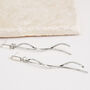 Long Drop Wavy Rod Crystal Earrings, thumbnail 2 of 3