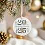 Personalised 2025 Baby's First Christmas Ceramic Bauble In Red, Pink Or Blue, thumbnail 3 of 9