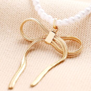 Pearl Necklace With Large Bow Pendant In Gold, 3 of 4