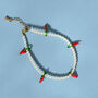Pearl And Chilli Charm Bracelet, thumbnail 1 of 4