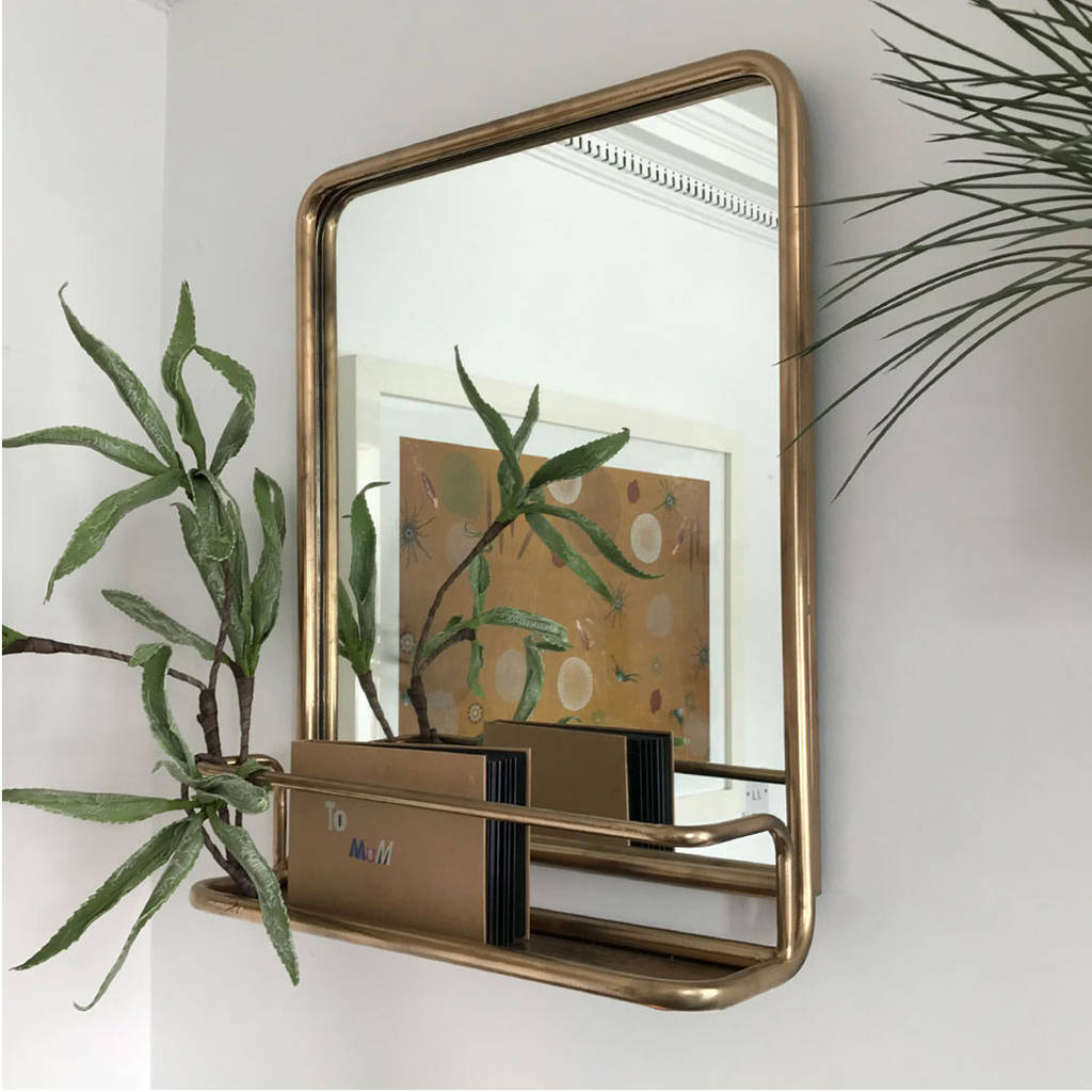black portrait metal mirror with shelf by doris brixham