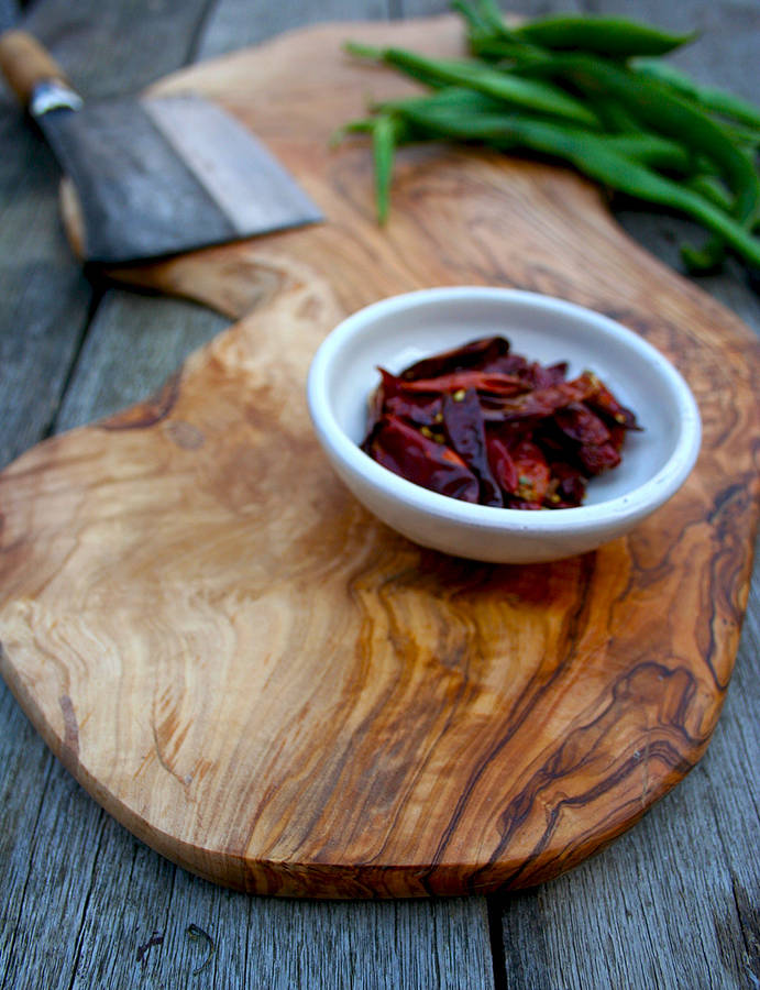 large rustic wooden serving board by the rustic dish
