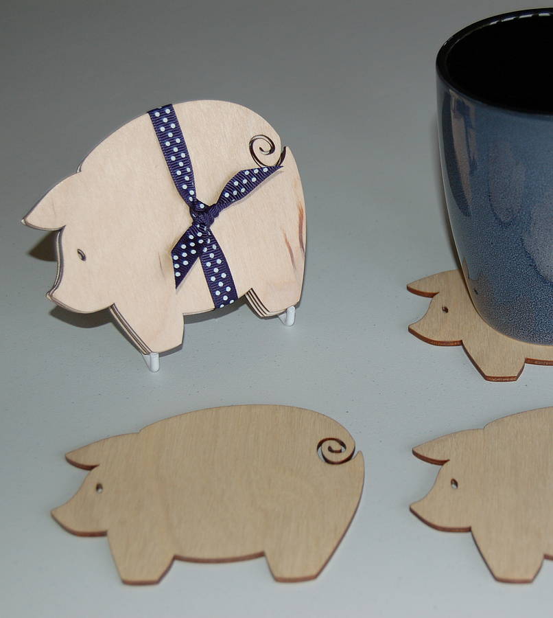 set of four wooden pig coasters by my blue dog | notonthehighstreet.com