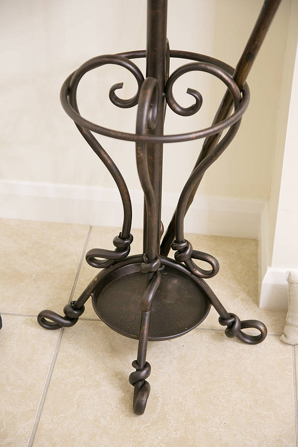 slender wrought iron coat stand by dibor