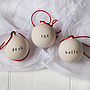 Deck The Halls Ceramic Christmas Baubles, thumbnail 1 of 2