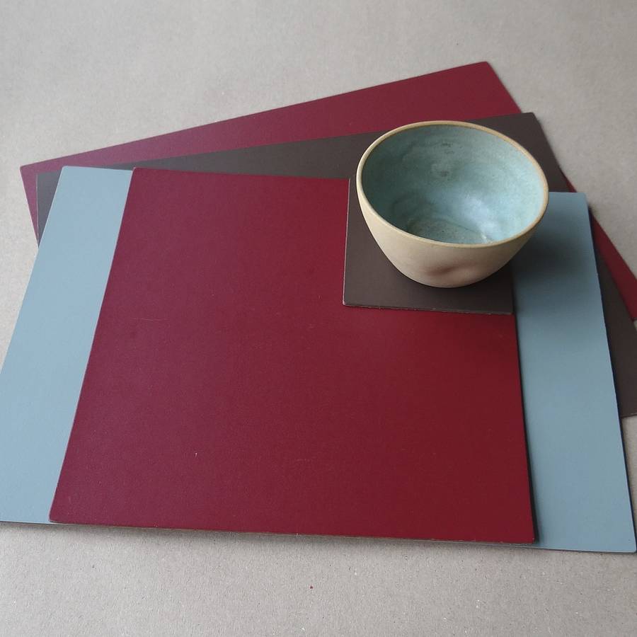 set of four square leather placemats by artbox
