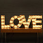 'Love' Light Up Fairground Bulb Sign, thumbnail 1 of 5