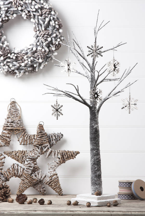 snow covered christmas tree by the christmas home | notonthehighstreet.com