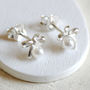 Tiny Sterling Silver Bow Pearl Stud Earrings, thumbnail 1 of 4
