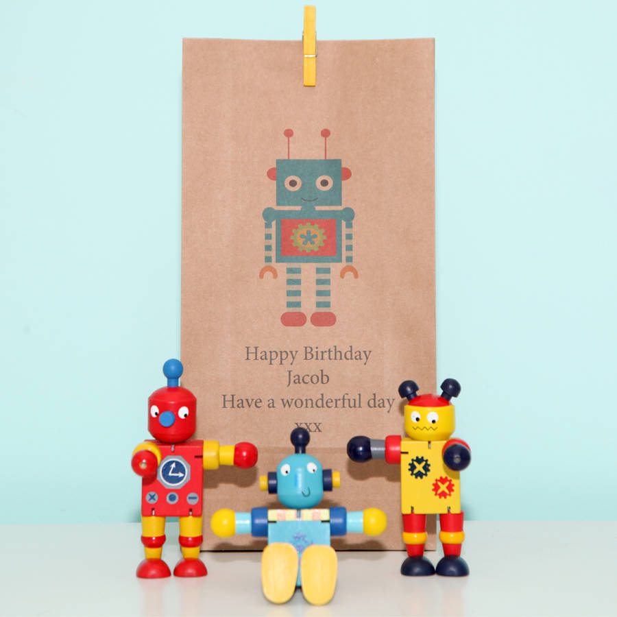Three Wooden Robots And Personalised Bag By Red Berry Apple