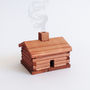 Smoking Wooden Log Cabin, thumbnail 3 of 10