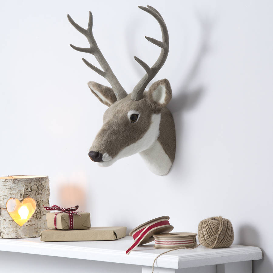Wall hanging reindeer head by the christmas home 