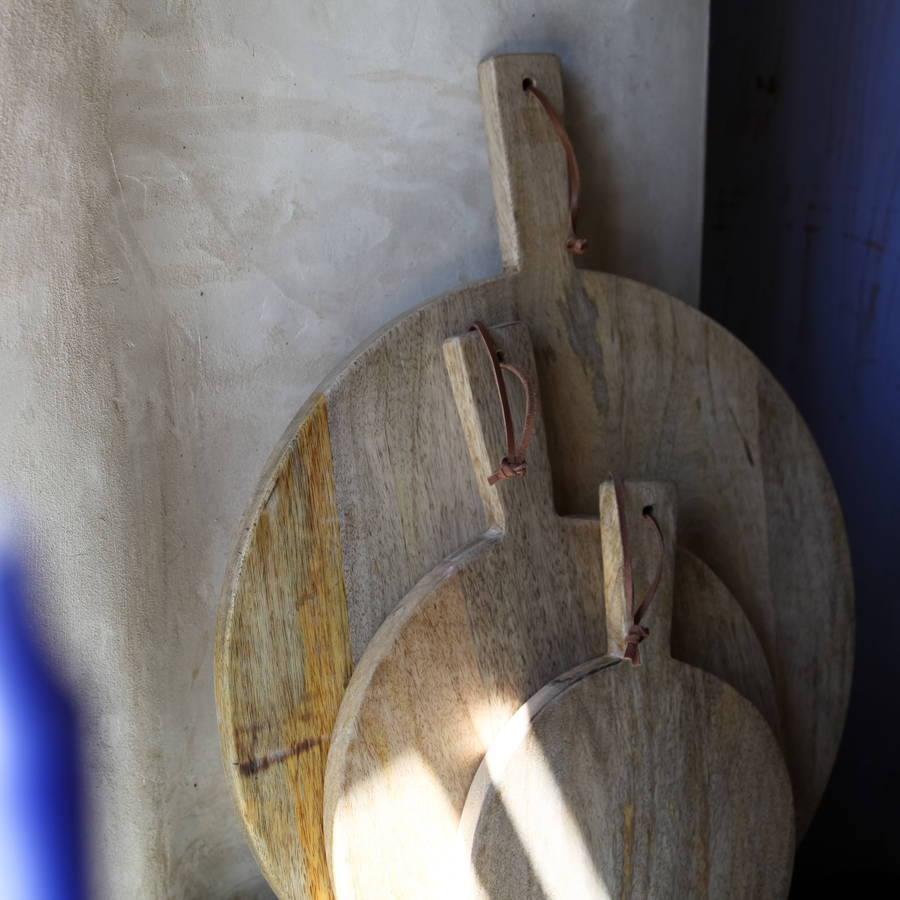 mango wood pizza board by nkuku