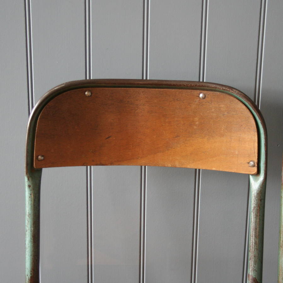 vintage industrial metal stacking chairs by homestead store