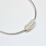 Silver Bangle With Oval Pillow Charm, thumbnail 1 of 3