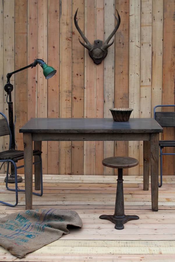 zinc topped table with aged oak trim by quirky interiors