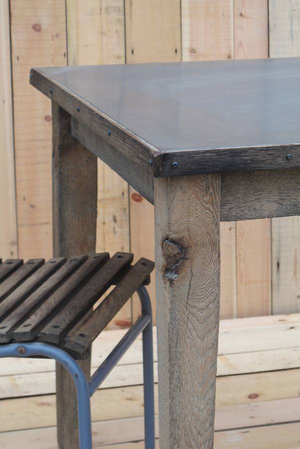 zinc topped table with aged oak trim by quirky interiors