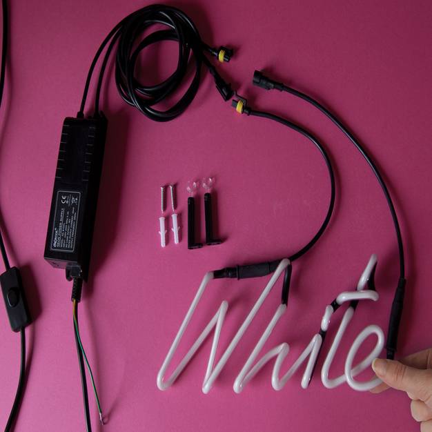 white neon word light by the letteroom