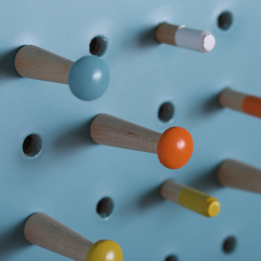 blue pegboard with wooden pegs, large by block design