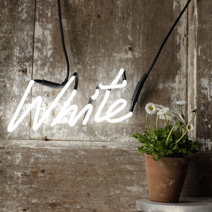 white neon word light by the letteroom