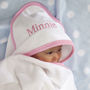 Personalised Hooded Baby Towel With Pink Or Blue Trim, thumbnail 2 of 11